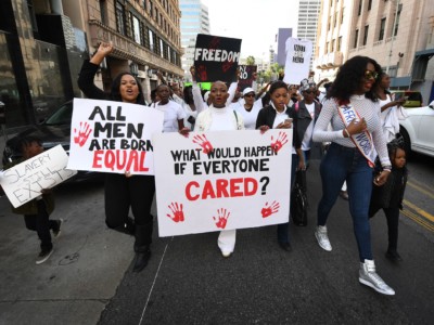 Marchers protest during the March Against Slavery to raise international awareness of migrants being abused and exploited, held in Los Angeles, California on January 27, 2018.