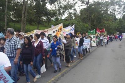 Protesters march from Mindo to Quito on March 22, 2018, near Nanegalito, Ecuador.