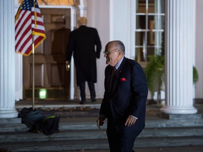 Rudy Giuliani walks to a vehicle after a meeting at the clubhouse at Trump National Golf Club Bedminster in Bedminster Township, New Jersey, on Sunday, November 20, 2016.
