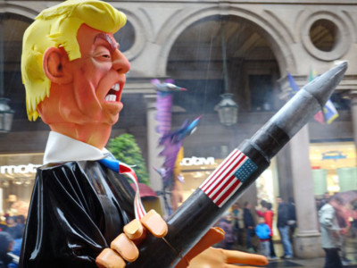 A puppet of Donald Trump with missiles takes part in an antiwar parade in Turin, Italy, May 1, 2017.