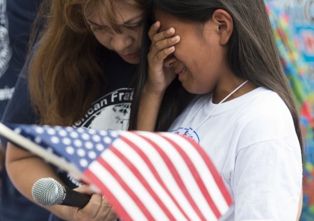 A young girl whose father was deported protest, cries during a protest in response to US President Barack Obama's delay on immigration reform in front of the White House in Washington, DC, September 8, 2014.