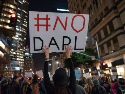 Protesters gather to denounce the Army Corps of Engineers decision to grant an easement for the Dakota Access Pipeline. Los Angeles, California, on February 8, 2017.