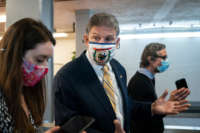 Sen. Joe Manchin speaks to reporters in the Senate subway following a vote at the U.S. Capitol on February 2, 2021, in Washington, D.C.