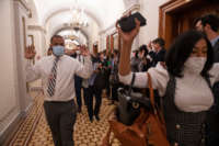 Congressional staff members are evacuated after Trump supporters breached the U.S. Capitol, interrupting a joint congressional session to certify the Electoral College vote in Washington, D.C., on Wednesday, January 6, 2021.