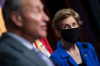 Sen. Elizabeth Warren looks past Senate Minority Leader Charles Schumer during a news conference in the Capitol on September 9, 2020.