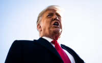 President Trump stops to talk to reporters as he walks to board Marine One and depart from the South Lawn at the White House on January 12, 2021, in Washington, D.C.