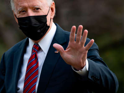President Biden waves as he arrives at the White House in Washington, D.C., on January 29, 2021.