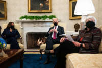 (L-R) Vice President Kamala Harris and President Joe Biden meet with Treasury Secretary Janet Yellen in the Oval Office of the White House on January 29, 2021, in Washington, D.C.
