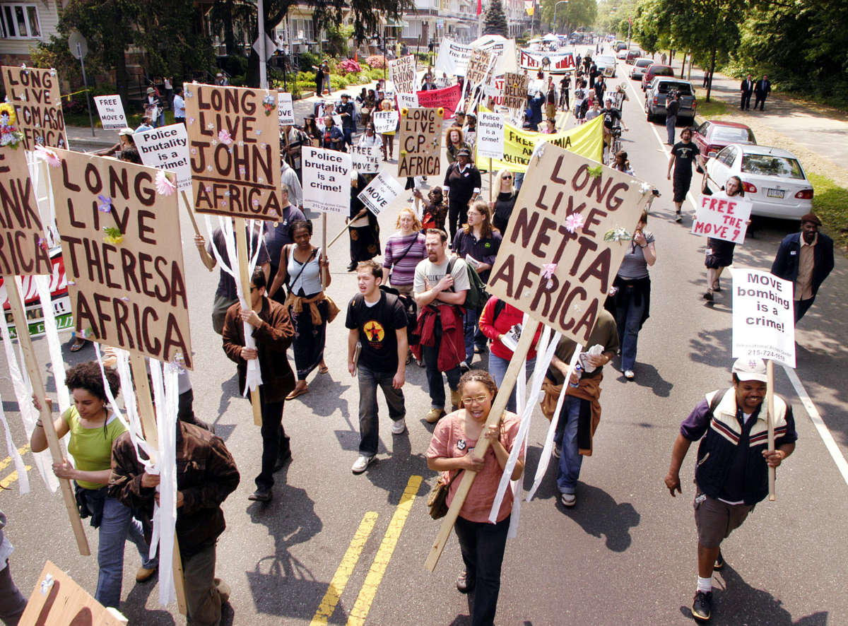 MOVE supporters march to commemorate the victims of the 1985 MOVE fire on May 14, 2005, in Philadelphia, Pennsylvania.