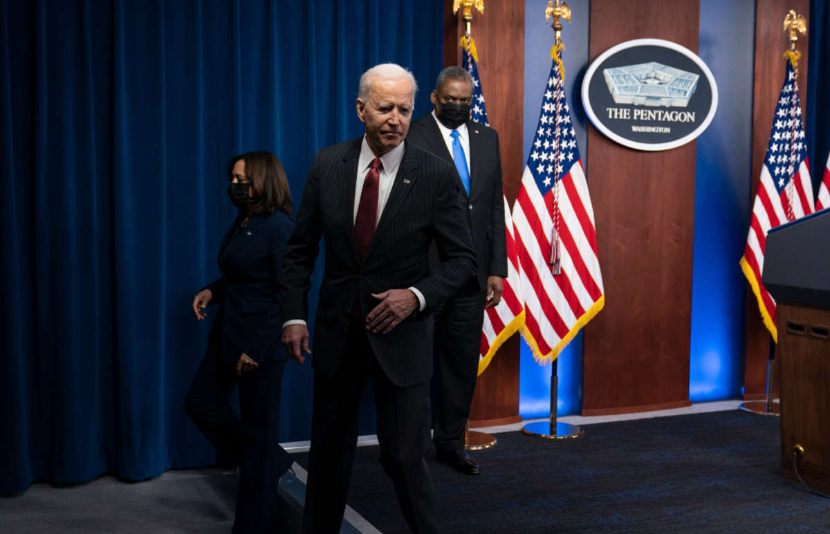 President Biden answers a reporter's question as he departs with Secretary of Defense Lloyd Austin and Vice President Kamala Harris at the Pentagon on February 10, 2021, in Washington, D.C.