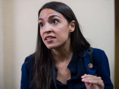 Rep. Alexandria Ocasio-Cortez talks with reporters after a meeting of the House Democratic Caucus on September 10, 2019.