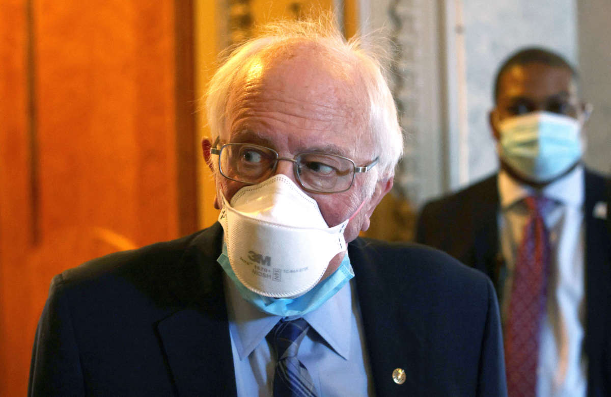 Sen. Bernie Sanders passes through a hallway at the U.S. Capitol on March 5, 2021, in Washington, D.C.