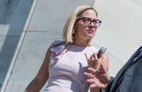 Then-Rep. Kyrsten Sinema leaves the Capitol on May 24, 2018.