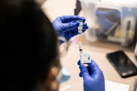 A nurse fills a syringe with a dose of the Johnson & Johnson COVID-19 vaccine at Wayside Christian Mission on March 15, 2021, in Louisville, Kentucky.