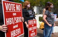 Opponents of several bills targeting transgender youth attend a rally at the Alabama State House to draw attention to anti-transgender legislation introduced in Alabama on March 30, 2021, in Montgomery, Alabama.