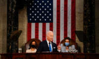 President Joe Biden addresses a joint session of Congress, with Vice President Kamala Harris and House Speaker Nancy Pelosi on the dais behind him, on April 28, 2021, in Washington, D.C.