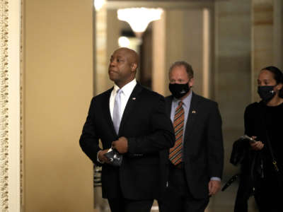 Sen. Tim Scott walks through the U.S. Capitol before he delivers the republican response to President Biden's address to congress on April 28, 2021, in Washington, D.C.
