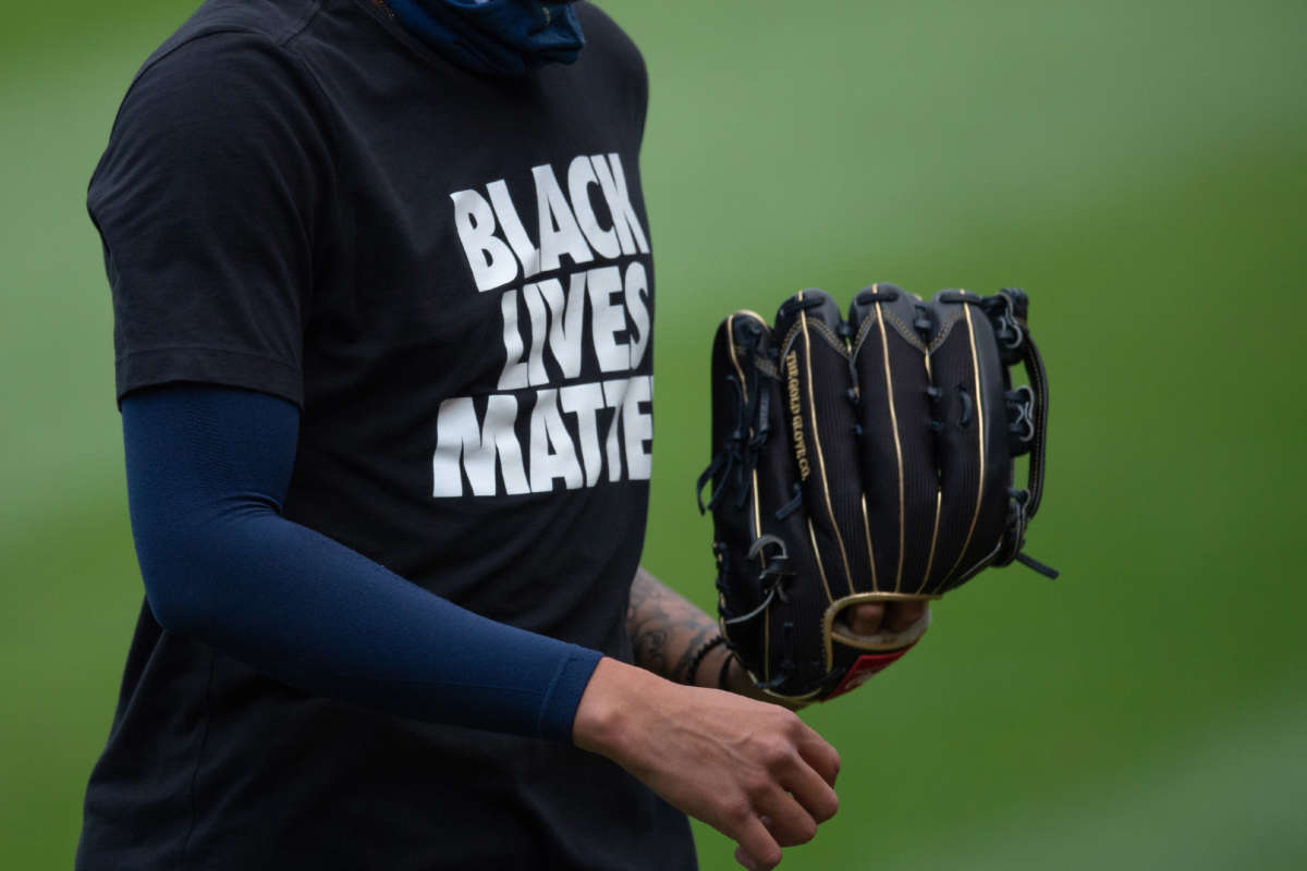 A Milwaukee Brewers player wears a Black Lives Matter shirt during warmups on August 5, 2020, at Guaranteed Rate Field in Chicago, Illinois.