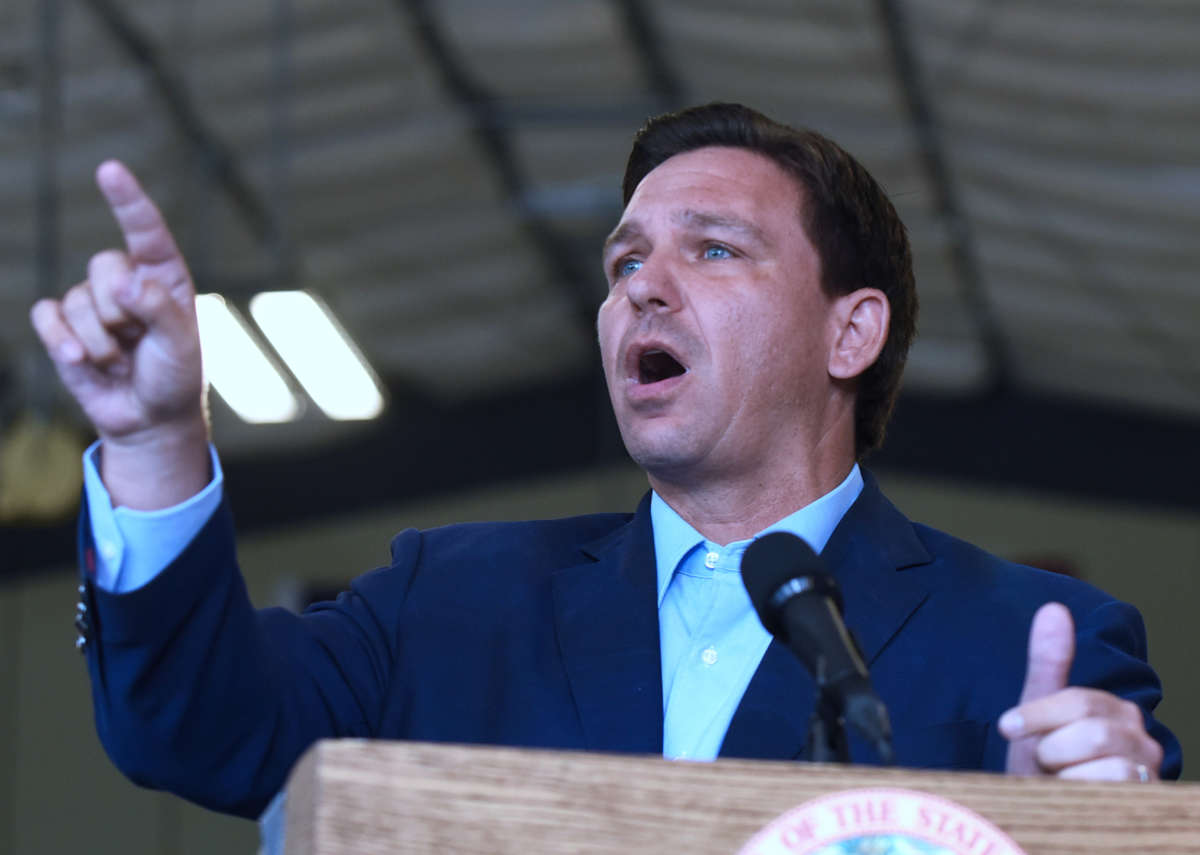Florida Gov. Ron DeSantis responds to a question from the media at a press conference at the Eau Gallie High School aviation hangar in Melbourne, Florida, on March 22, 2021.