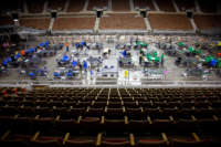 Contractors working for Cyber Ninjas, who was hired by the Arizona State Senate, examine and recount ballots from the 2020 general election at Veterans Memorial Coliseum on May 1, 2021, in Phoenix, Arizona.