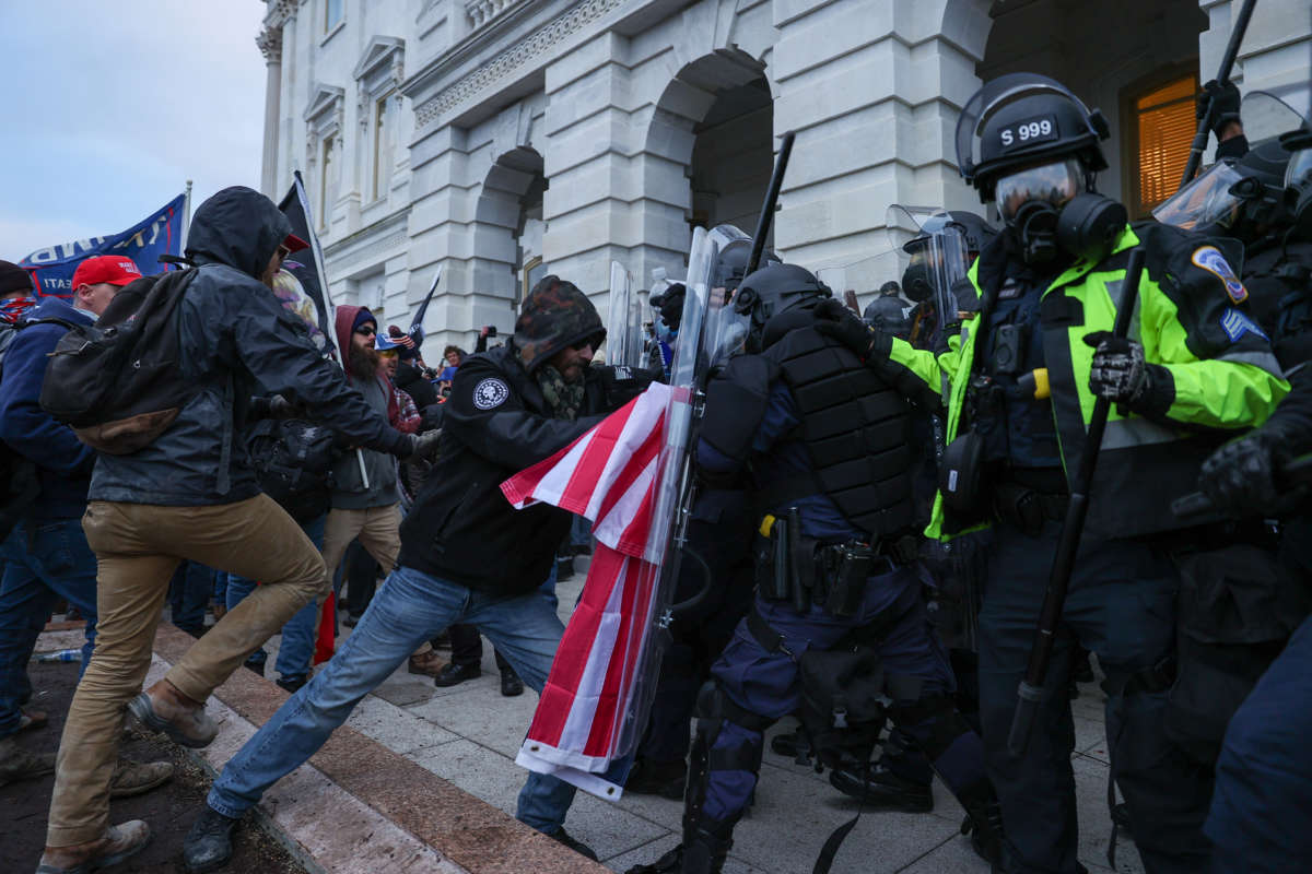 Security forces clash with Trump supporters after they breached the U.S. Capitol security in Washington, D.C., on January 6, 2021.
