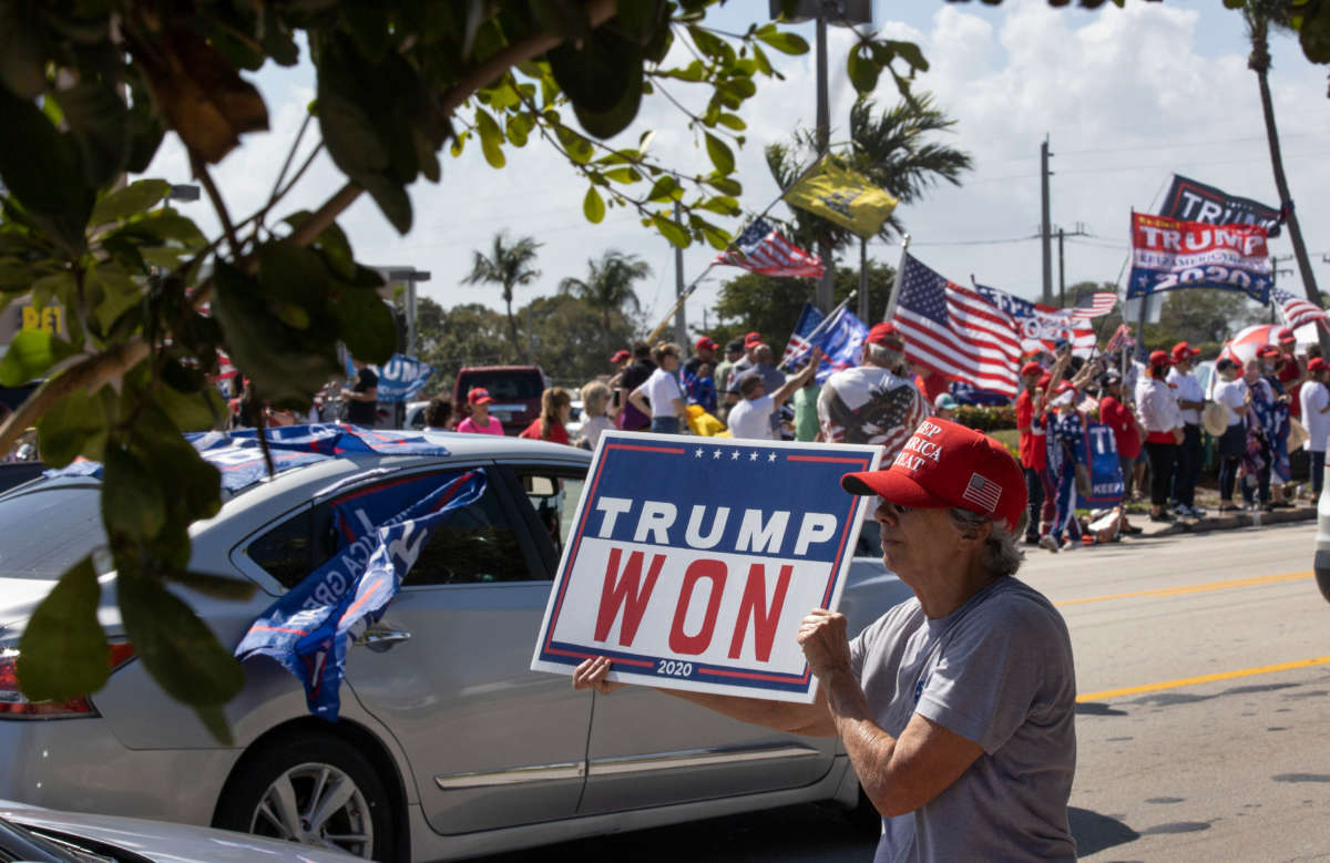 Supporters of former President Donald Trump gather along Southern Blvd. near Trump's Mar-a-Lago home on February 15, 2021, in West Palm Beach, Florida.