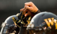 Wake Forest Demon Deacon players join hands prior to the game against the Liberty Flames at BB&T Field on September 1, 2012, in Winston Salem, North Carolina.