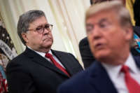 Attorney General William Barr and President Donald Trump attend a signing ceremony for an executive order in the Oval Office of the White House on November 26, 2019, in Washington, D.C.