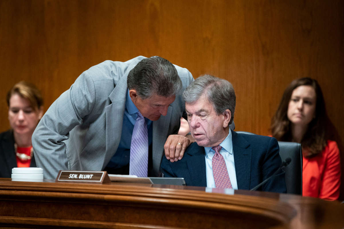 Sen. Roy Blunt, right, speaks with Sen. Joe Manchin during a Senate Appropriations Subcommittee hearing in Washington, D.C., on June 9, 2021.