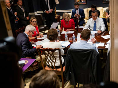 Senators Bill Cassidy, Kyrsten Sinema, Lisa Murkowski and Mitt Romney hold a bipartisan meeting on infrastructure in the basement of the U.S. Capitol building on June 8, 2021, in Washington, D.C.