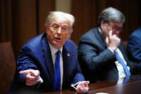 President Donald Trump, with Attorney General William Barr, speaks during a discussion in the Cabinet Room of the White House in Washington, D.C., on September 23, 2020.