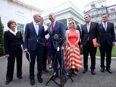 President Joe Biden speaks outside the White House with a bipartisan group of senators after meeting on an infrastructure deal on June 24, 2021, in Washington, D.C.