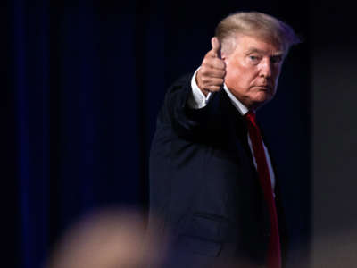 Former President Donald Trump give a thumbs up as he walks off after speaking at the Conservative Political Action Conference in Dallas, Texas, on July 11, 2021.