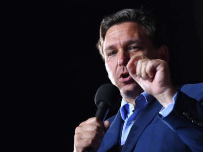Florida Gov. Ron DeSantis gestures as he speaks during a campaign rally at Pensacola International Airport in Pensacola, Florida, on October 23, 2020.
