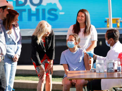 Singer & songwriter Brad Paisley, Kimberly Williams-Paisley and First Lady Jill Biden tour a Pop-Up Vaccination site at Ole Smoky Distillery on June 22, 2021, in Nashville, Tennessee.