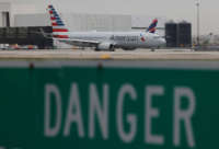 An American Airlines plane taxis to the runway at the Miami International Airport on June 16, 2021, in Miami, Florida.