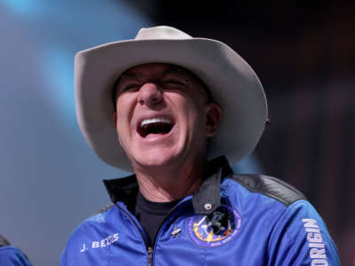 Jeff Bezos laughs as he speaks about his flight on Blue Origin’s New Shepard during a press conference on July 20, 2021, in Van Horn, Texas.