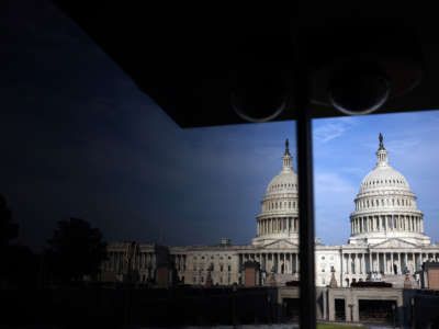 The U.S. Capitol Building is seen reflecting on glass on July 26, 2021, in Washington, D.C.