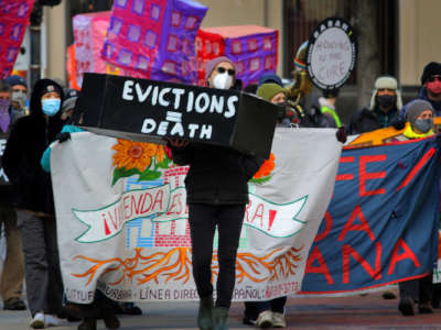 Boston tenants, faith leaders, and small landlords rally and march, calling for a stronger, longer federal eviction ban as part of a National Day of Action to Prevent Evictions in Boston, Massachusetts, on January 13, 2021.