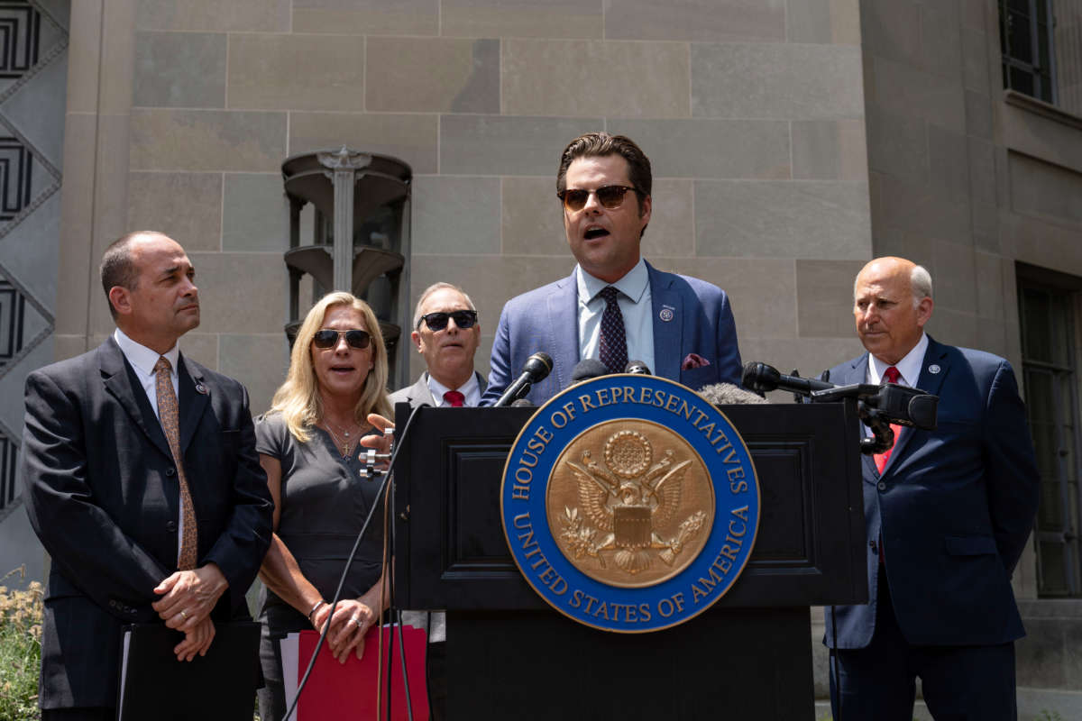 From left, Representatives Bob Good, Marjorie Taylor Greene, Andy Biggs, Matt Gaetz and Louie Gohmert hold a news conference outside the U.S. Department of Justice on July 27, 2021, in Washington, D.C.