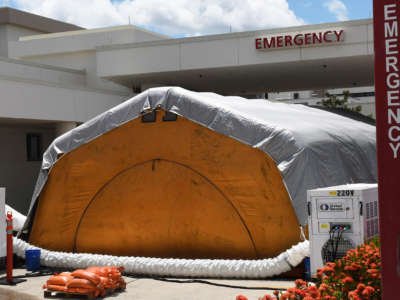 A treatment tent is seen outside the emergency department at Holmes Regional Medical Center in Melbourne., Florida, on July 29, 2021.