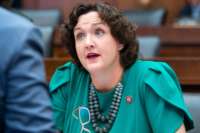 Rep. Katie Porter speaks to someone