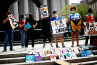 People attend a protest and display signs in support of DACA (Deferred Action for Childhood Arrivals)
