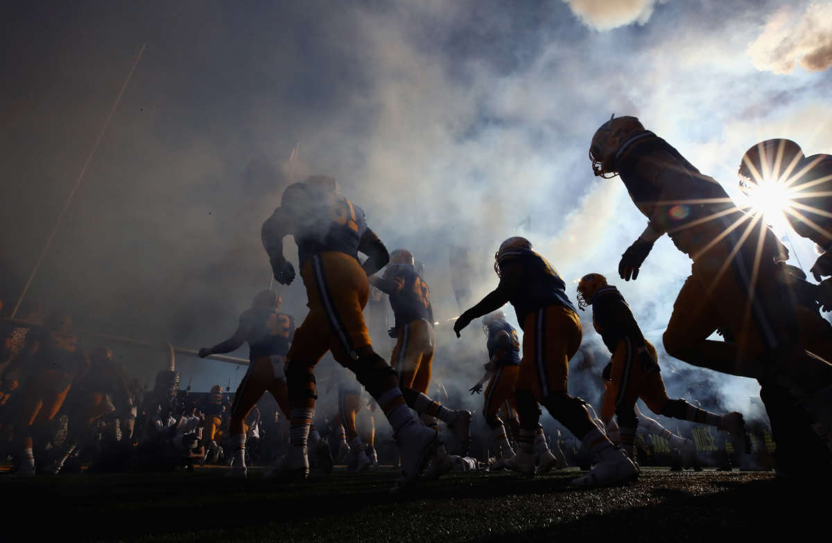 The California Golden Bears run out on to the field for their game against the UCLA Bruins at California Memorial Stadium on October 13, 2018, in Berkeley, California.