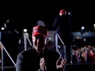 White House Chief of Staff Mark Meadows claps as President Donald Trump leaves after speaking during a rally at Hickory Regional Airport in Hickory, North Carolina, on November 1, 2020.