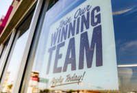 A help wanted sign reads "Join Our Winning Team, Apply Today!" in the window of a Jersey Mike's Subs location in Muhlenberg, Pennsylvania, on August 26, 2021.