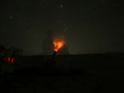 US Marines fire a non-explosive illumination round using an 81mm mortar to deter enemy activity near Gereshk, Afghanistan, September 23, 2017.