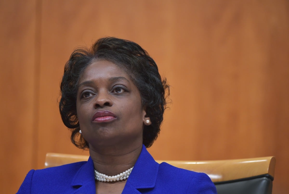 Federal Communications Commissioner Mignon Clyburn listens to a fellow commissioner speak during a FCC hearing on the internet on February 26, 2015, in Washington, DC.