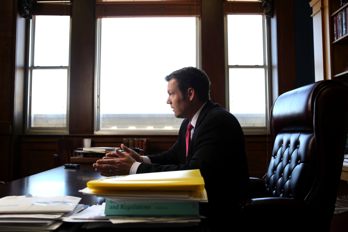 Kansas Secretary of State Kris Kobach discusses the Kansas proof of citizenship requirements for voter registration in his office in Topeka, Kansas, February 17, 2015.