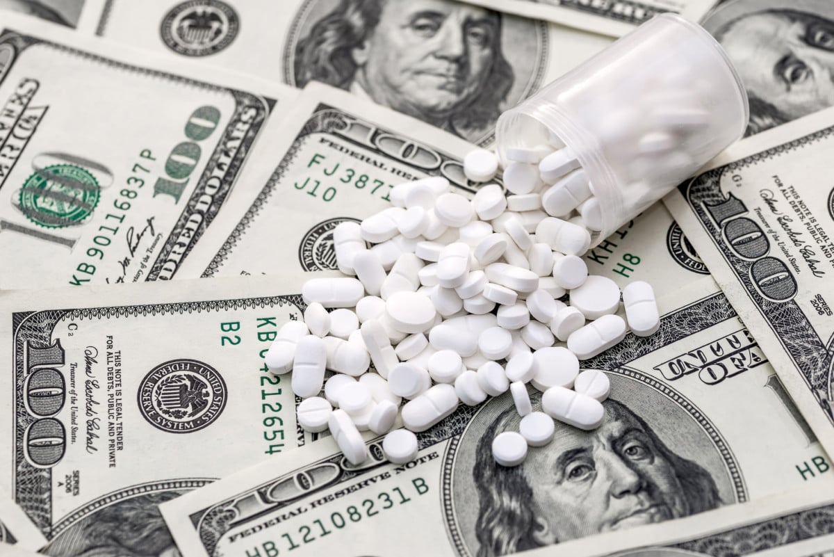 White tablets are scattered for dollars.